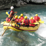 Group in white water raft on river